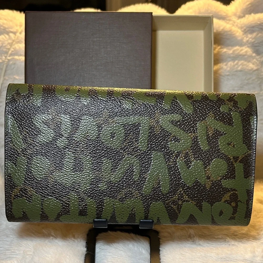 338. Louis Vuitton Limited Edition Monogram Graffiti Sarah Wallet,